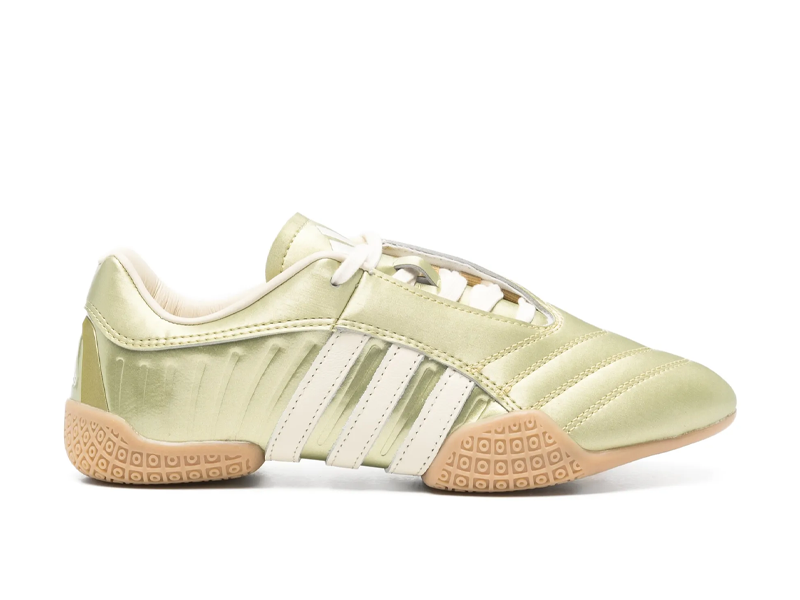 Close-up of Adidas Taekwondo Mei Elite shoes in gold, featuring a thin sole, layered leather upper, and ballet-inspired lacing for the 2026 sneakerina trend.