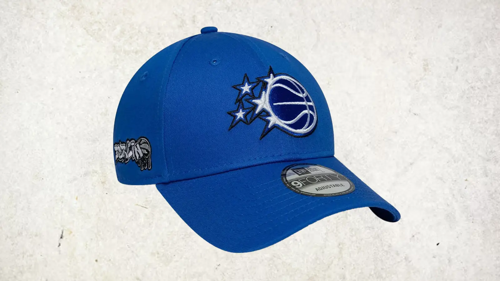 New Era Memphis Grizzlies NBA Berlin 2026 9FORTY adjustable cap in blue with right-panel graffiti embroidery and structured crown.