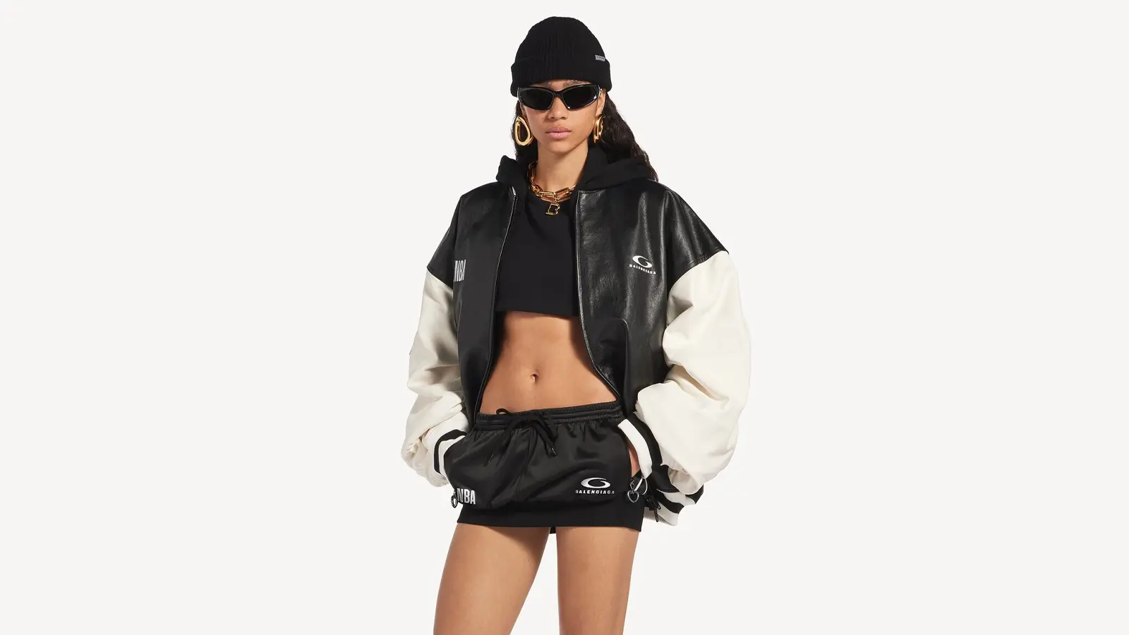 Editorial campaign image of the Balenciaga x NBA Fall 2026 collection, styled with oversized proportions and NBA tricolor branding.
