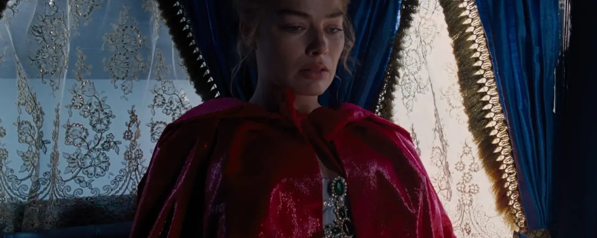 A movie still of Margot Robbie as Catherine Earnshaw in Emerald Fennell’s Wuthering Heights (2026), showcasing the dark gothic aesthetic central to the Wuthering Heights movie delulu marketing campaign.