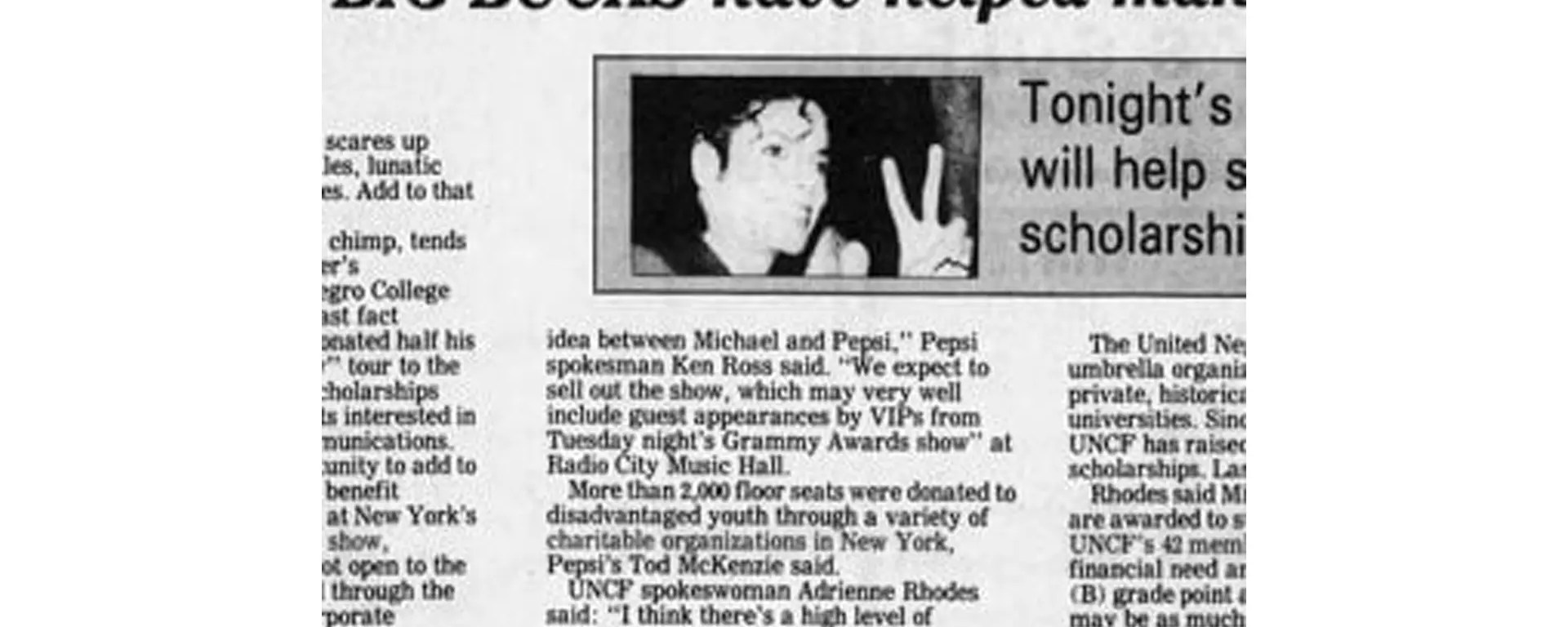 Archival newspaper clipping of Michael Jackson presenting a 1.5 million dollar check to the United Negro College Fund (UNCF) in 1984.
