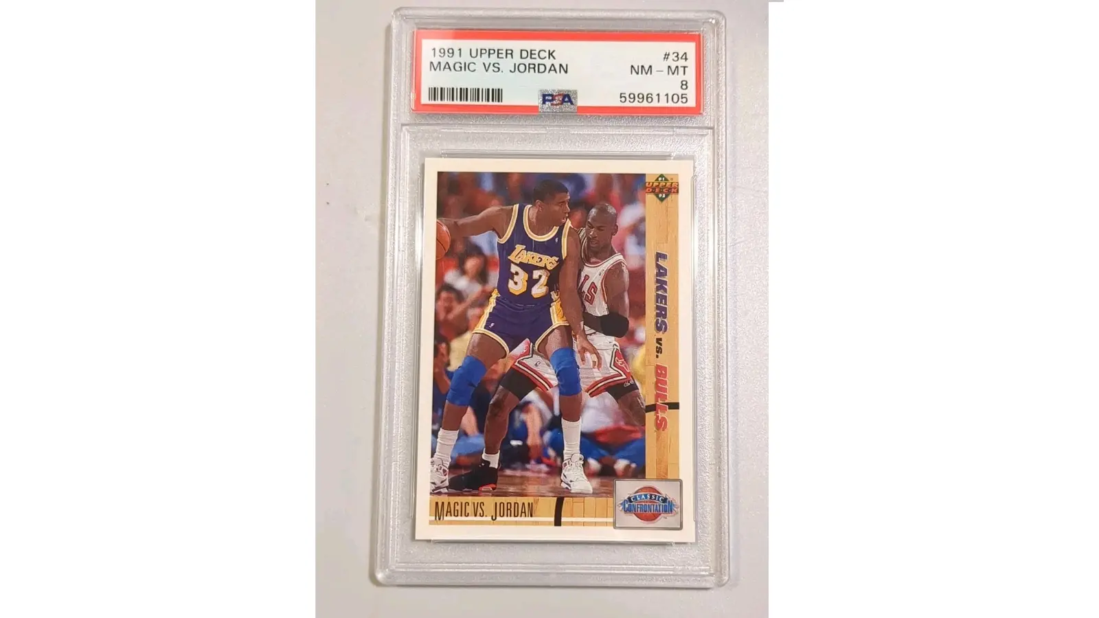 High-resolution image of the 1991 Upper Deck basketball card number 34 featuring Magic Johnson defending Michael Jordan.