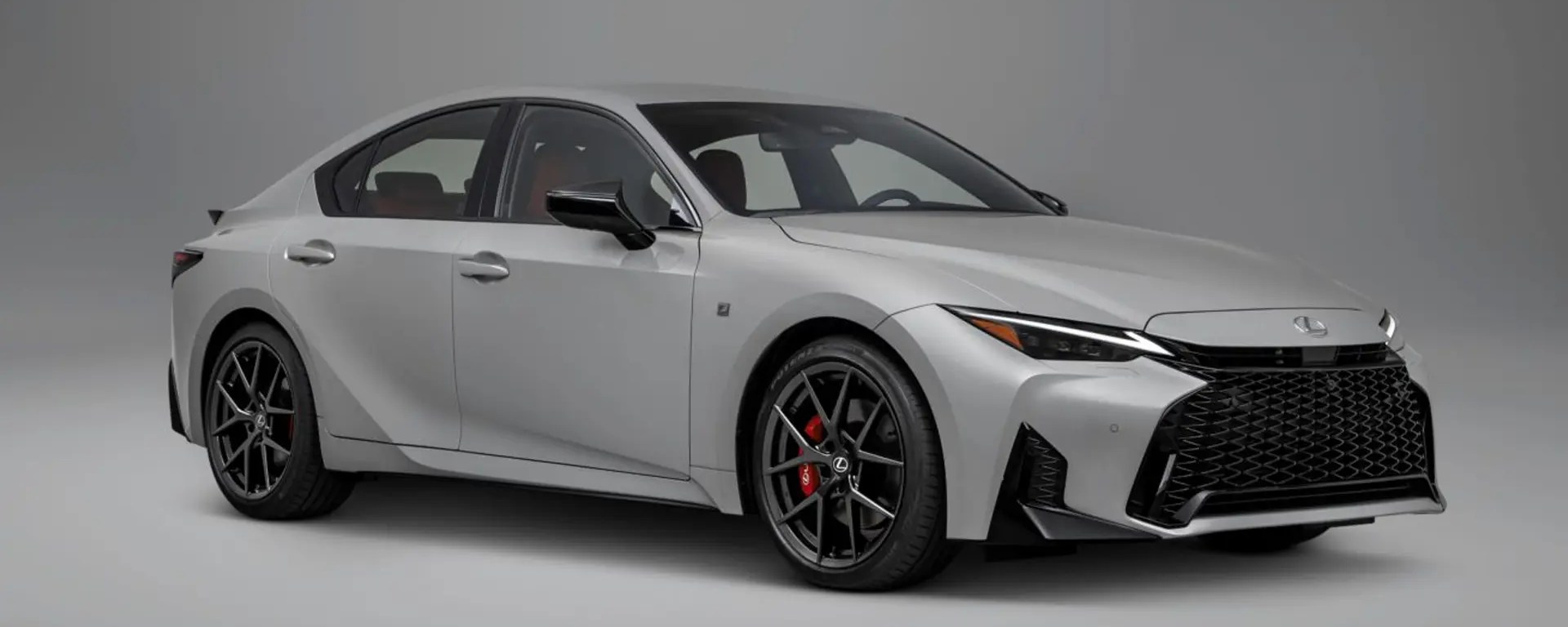 2026 Lexus IS parked in a neutral setting, showcasing its restrained exterior design and modern proportions