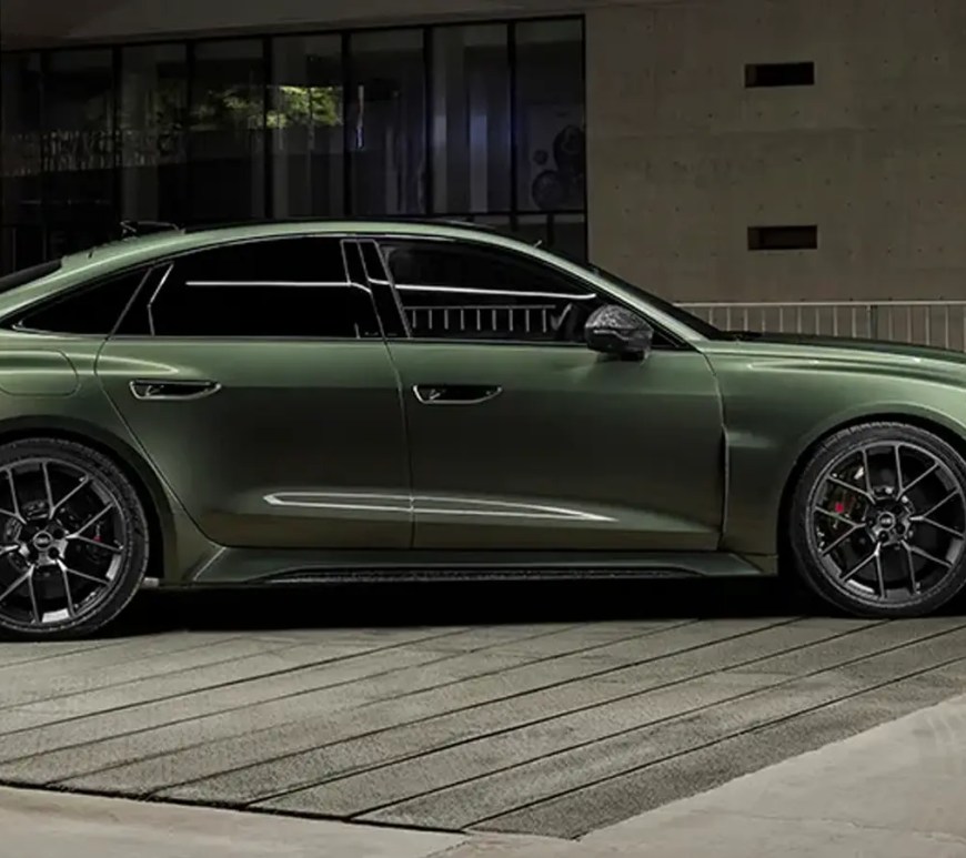 A profile shot of the 2027 Audi RS5 in Bedford Green, highlighting its widened stance and aggressive RS bodywork.