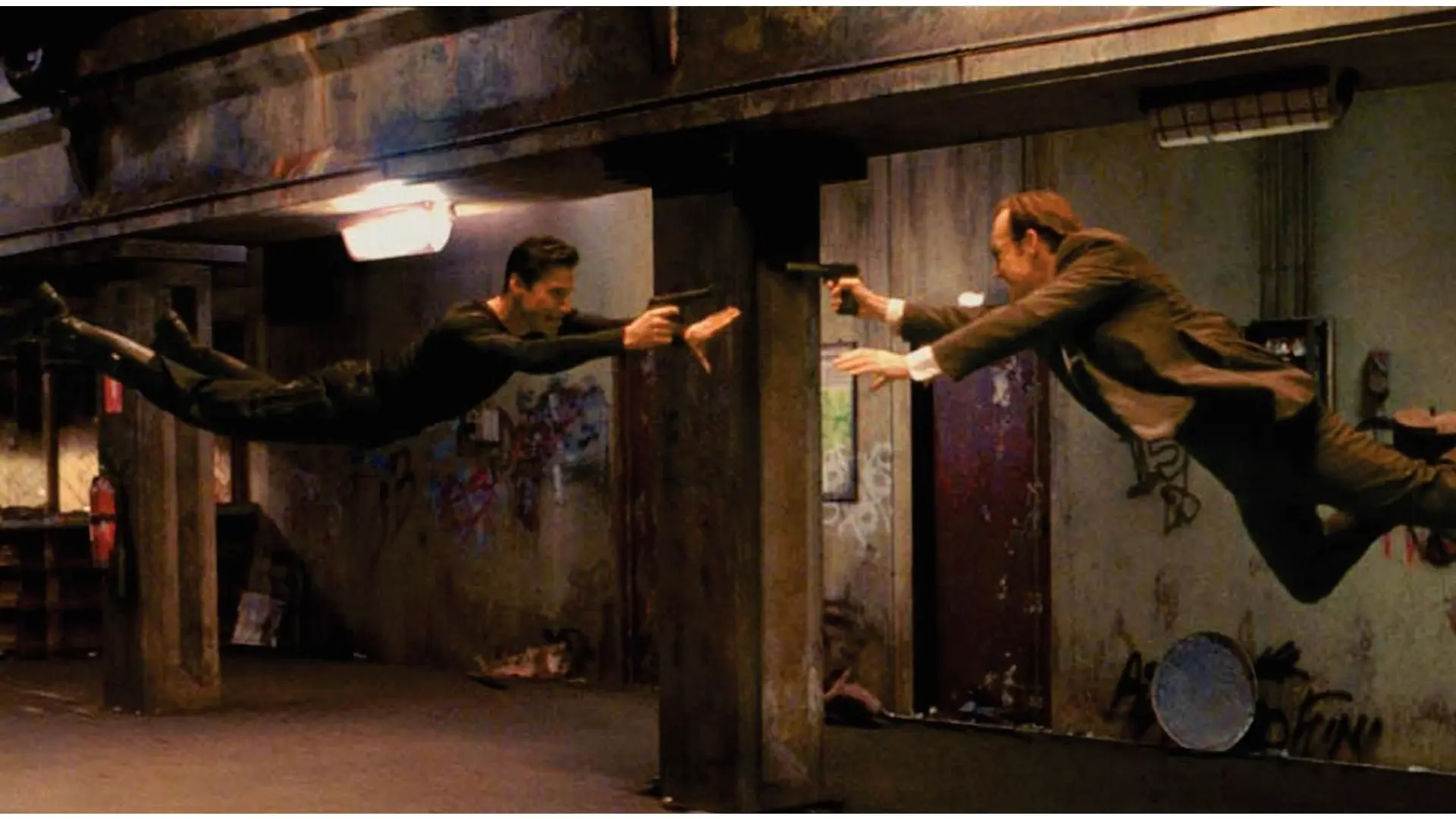 Close-up of Neo, played by Keanu Reeves, wearing black sunglasses in a scene from The Matrix (1999).