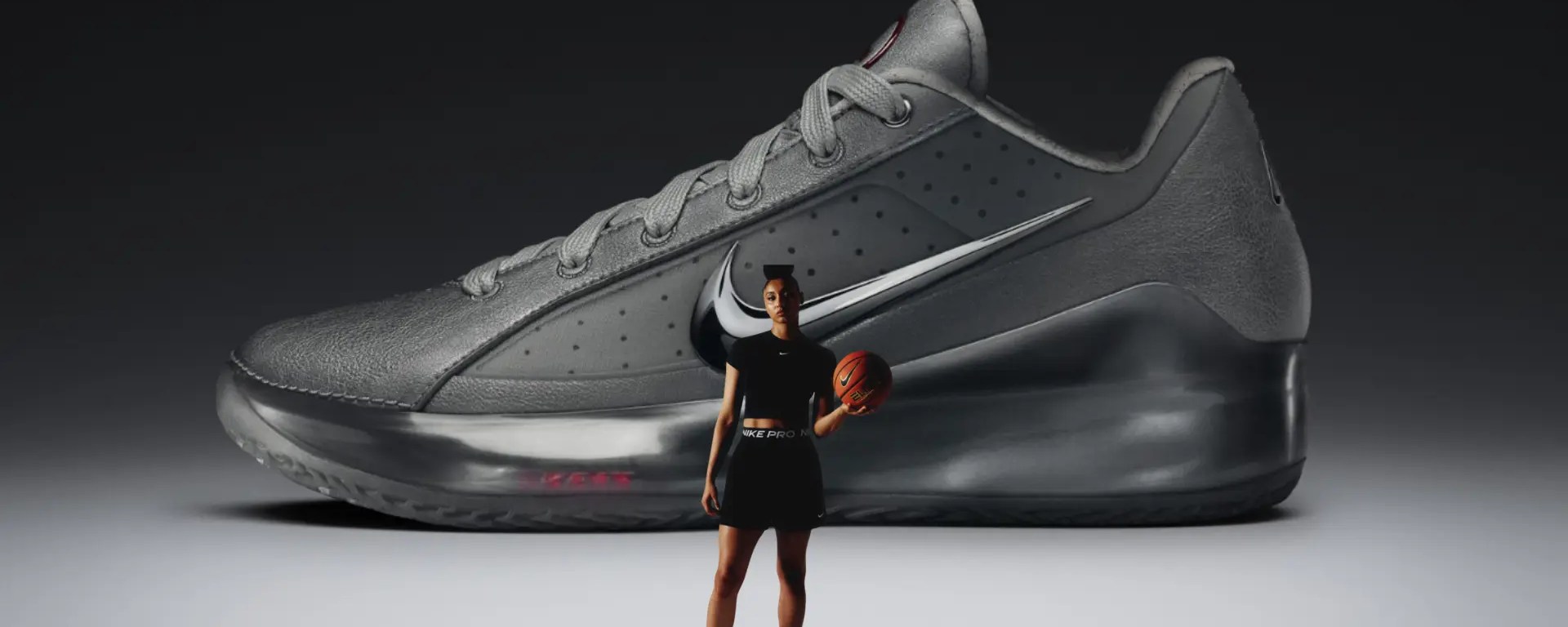 A high-contrast profile of the Nike LeBron NXXT Gen JW 'Silver Lining,' showcasing the iridescent Metallic Silver finish, Jewel Swoosh, and the technical architecture co-designed by JuJu Watkins.