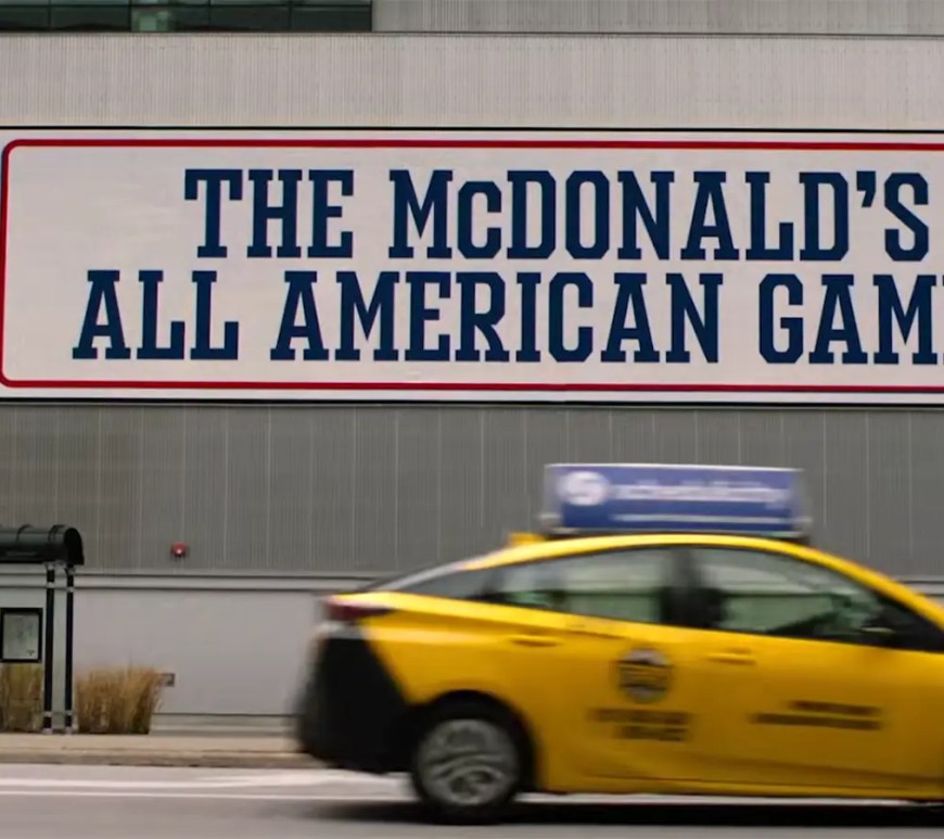 High-fidelity archival still from the Prime Video documentary Meal Ticket, showcasing the cinematic directorial style of Coodie and Chike (Creative Control) and the heritage of the McDonald’s All American Games.