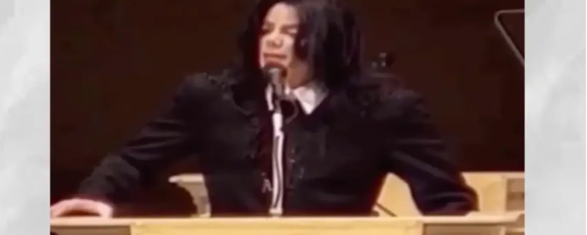 Michael Jackson delivers his historic 'Heal the Kids' address at the Oxford Union in 2001, wearing a black military-inspired tunic and speaking on the global architecture of child welfare.