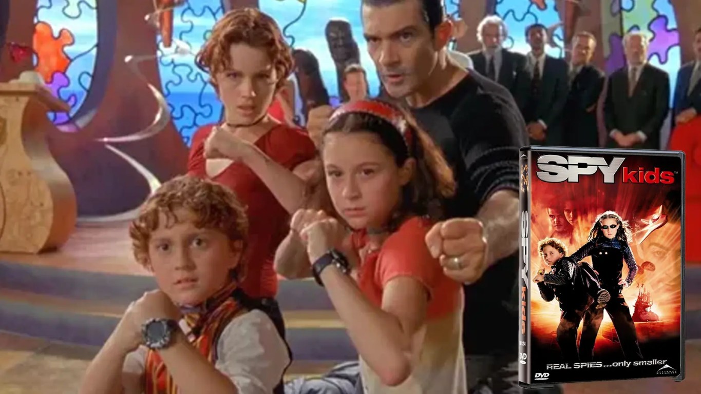 A high-fidelity studio shot of the Spy Kids (2001) DVD case, featuring the Cortez family (Antonio Banderas, Carla Gugino, Alexa PenaVega, and Daryl Sabara). The archival physical media represents the 2001 transition from 35mm physical film to the early digital mastering era at Troublemaker Studios.