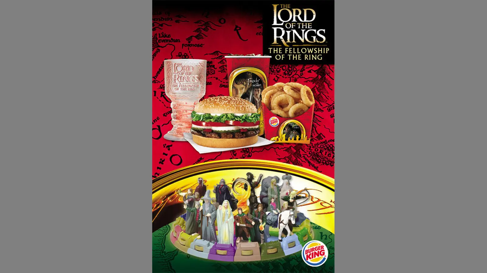 Detailed view of the 2001 Burger King Fellowship of the Ring light-up glasses showcasing the gold LED pedestal and frosted map etching.