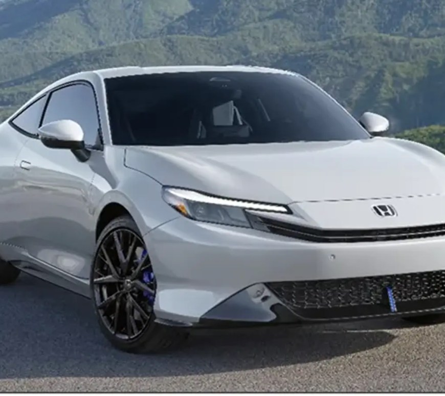 Profile view of the 2026 Honda Prelude in Winter Frost Pearl, highlighting the 'double-bubble' roofline, flush door handles, and 19-inch Berlina Black wheels with blue Brembo brake calipers.