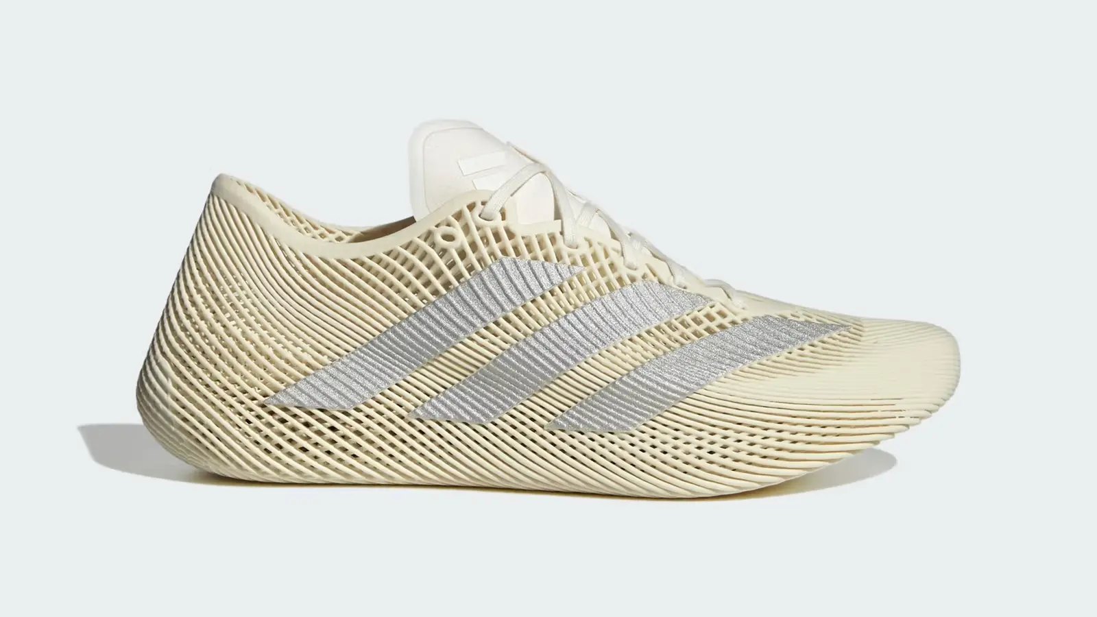 A side profile of the Adidas CLIMACOOL LACED in Off White and Silver Metallic, showcasing the intricate 3D-printed lattice structure.