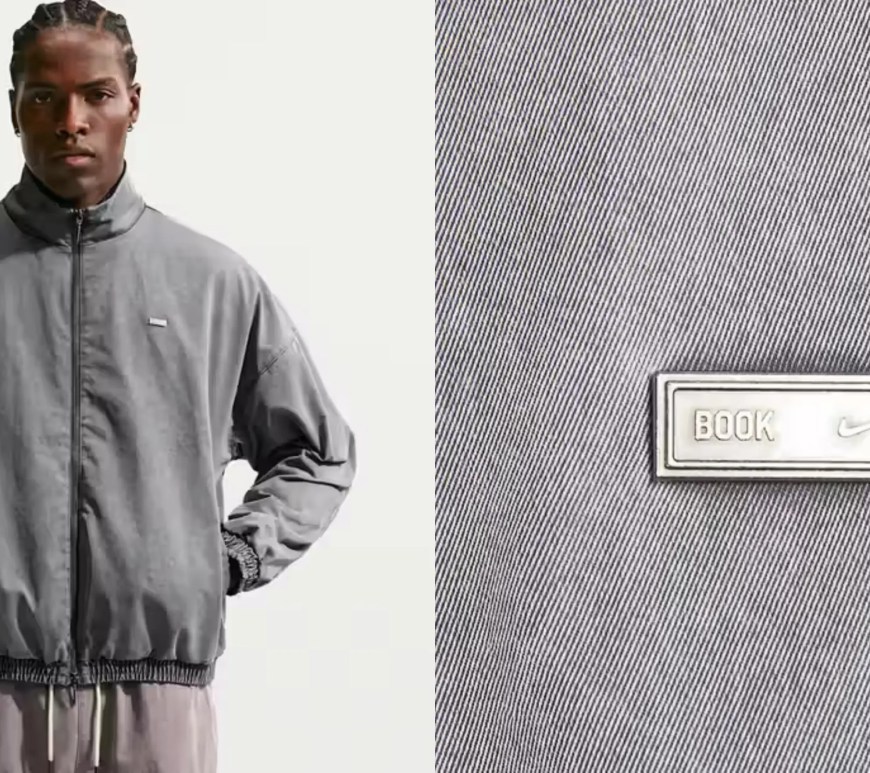A studio profile of the Nike Book 'Chapter II' Woven Game Jacket in both Black and Tattoo colorways, showcasing the sun-faded dye finish, Dri-FIT woven fabric, and relaxed fit.