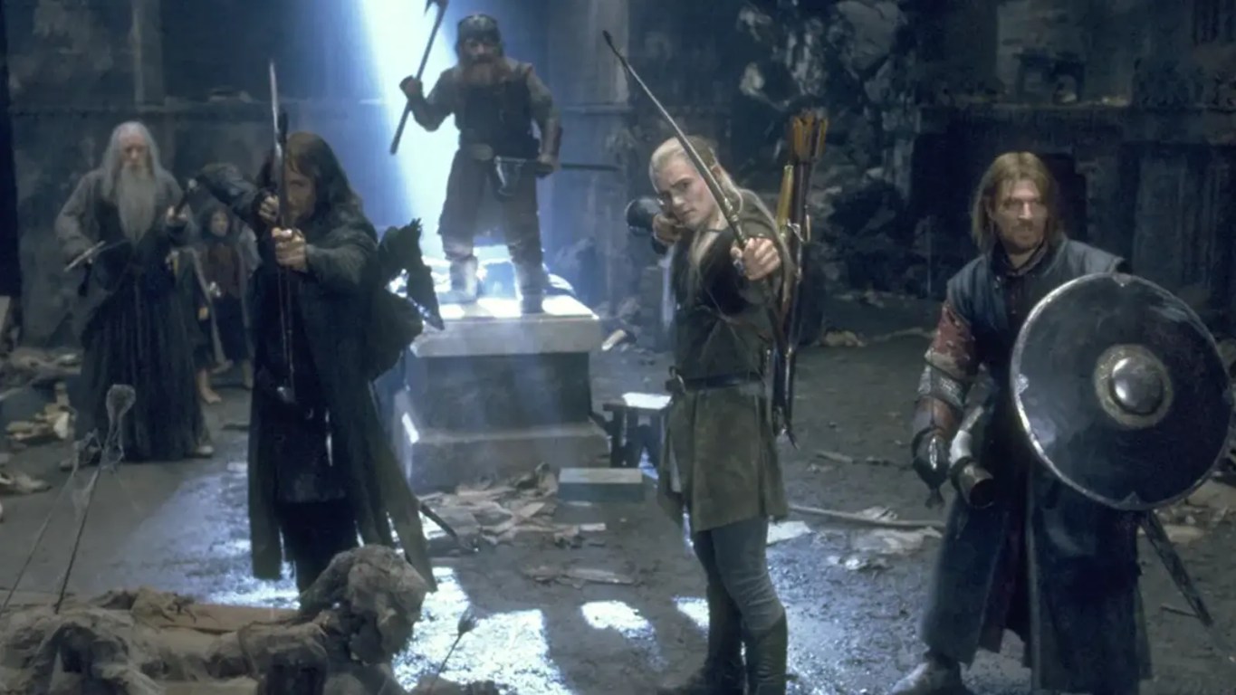 A high definition cinematic still of the Argonath monuments from The Lord of the Rings: The Fellowship of the Ring, representing the 915 million dollar lifetime box office milestone and the enduring ROI of Peter Jackson’s analog production hardware during the 2026 anniversary re-release.