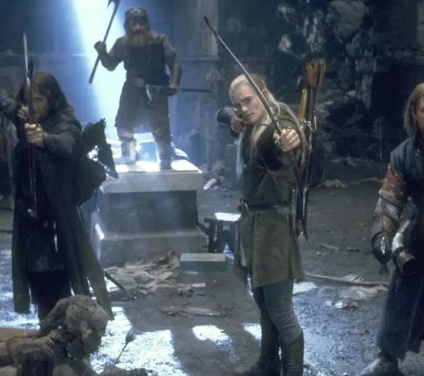 A high definition cinematic still of the Argonath monuments from The Lord of the Rings: The Fellowship of the Ring, representing the 915 million dollar lifetime box office milestone and the enduring ROI of Peter Jackson’s analog production hardware during the 2026 anniversary re-release.