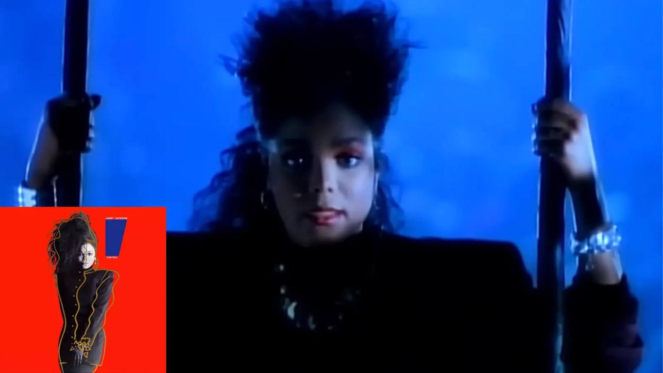A music video still of Janet Jackson performing 'Control' at the Grand Olympic Auditorium in 1986, showcasing the sharp, angular choreography and industrial-inspired stage lighting that defined the era.