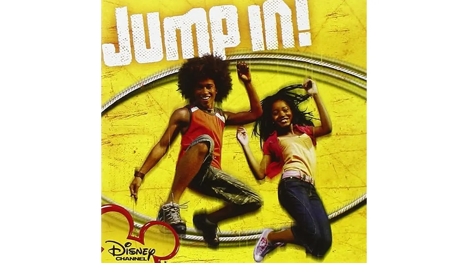 A high-energy movie still from the 2007 Disney Channel Original Movie 'Jump In!' featuring Corbin Bleu as Izzy Daniels and Keke Palmer as Mary Thomas during the Double Dutch City Finals, showcasing the high-velocity athletic synchronization and 35mm film aesthetic.