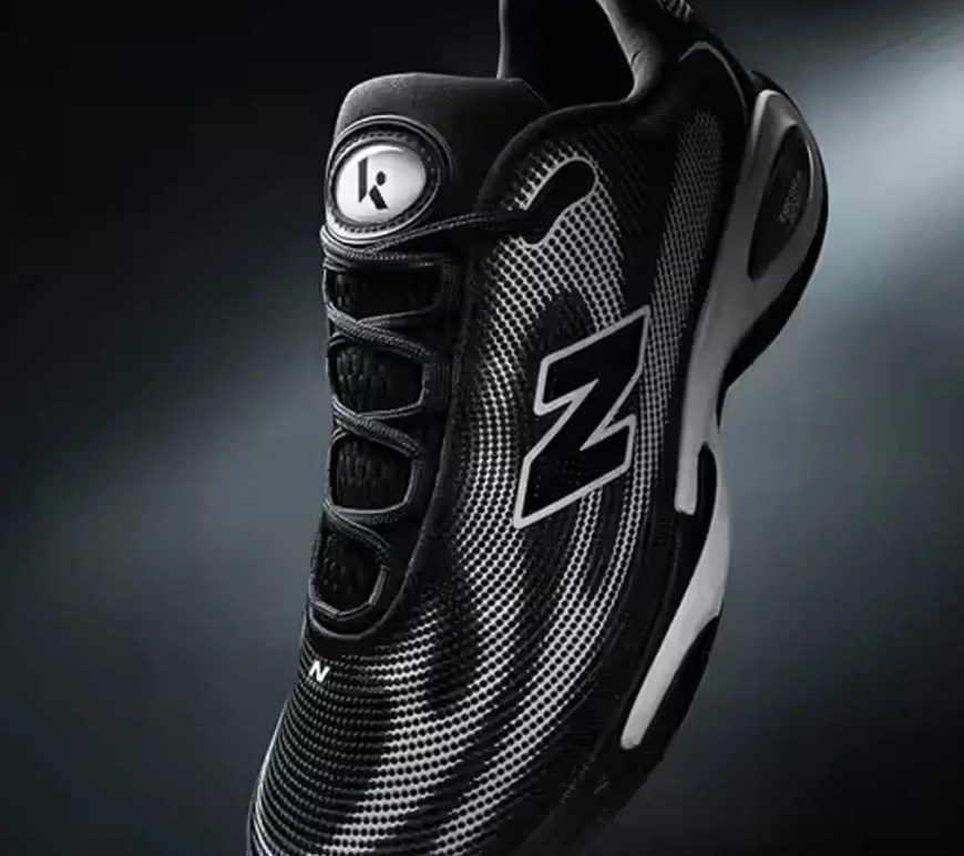 Front shot of the Klutch Athletics x New Balance Spring 2026 AC Runner in Black/White, featuring topographical graphic overlays and a sculpted Fresh Foam X midsole.