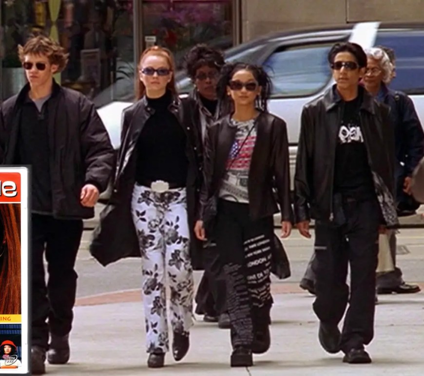 Film still from the final scene of Disney Channel’s Get a Clue (2002). The 'The Four'—Lexy Gold (Lindsay Lohan), Jack Downey (Bug Hall), Jennifer (Brenda Song), and Gabe (Ali Mukaddam)—are walking side-by-side down a New York City street. They are all wearing high-saturated Y2K fashion, including Lexy's pink newsboy cap and tweed mini-skirt, and Gabe's athletic blue pullover. They are laughing as they merge into the crowd of NYC pedestrians.