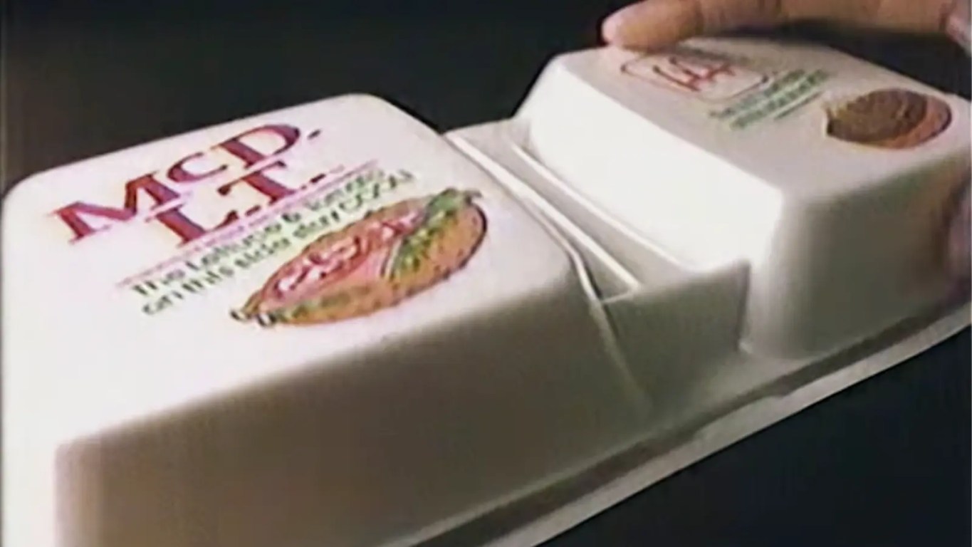 The original 1980s McDonald's McDLT dual-chamber styrofoam packaging, showing the separated burger components.