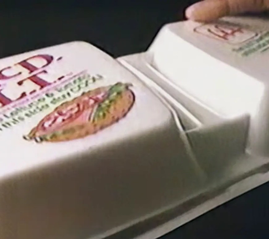 The original 1980s McDonald's McDLT dual-chamber styrofoam packaging, showing the separated burger components.
