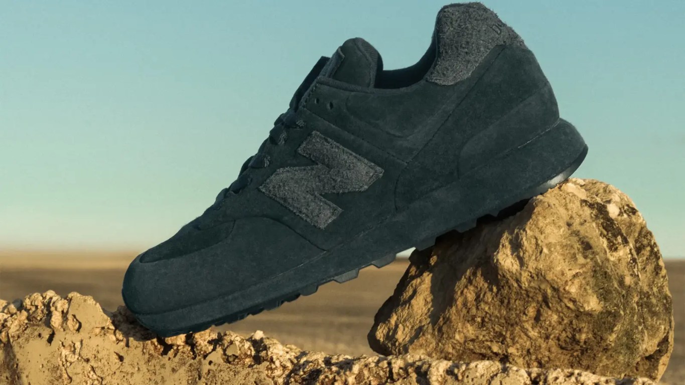 Profile of the Stone Island x New Balance 574 Ghost 2.0 in Dust Grey featuring a unique suede-wrapped midsole.