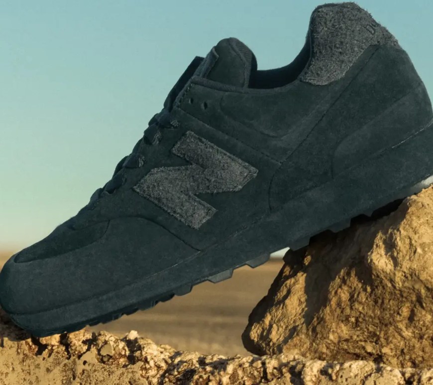 Profile of the Stone Island x New Balance 574 Ghost 2.0 in Dust Grey featuring a unique suede-wrapped midsole.