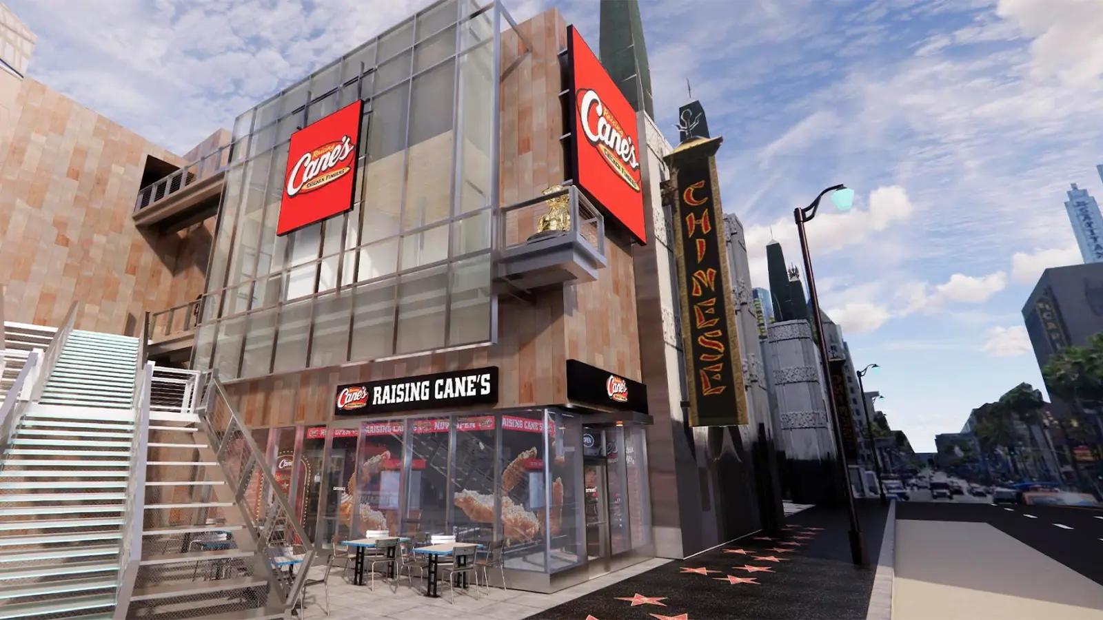 The 1,000th Raising Cane’s location on Hollywood Boulevard, featuring a golden dog statue on the balcony.