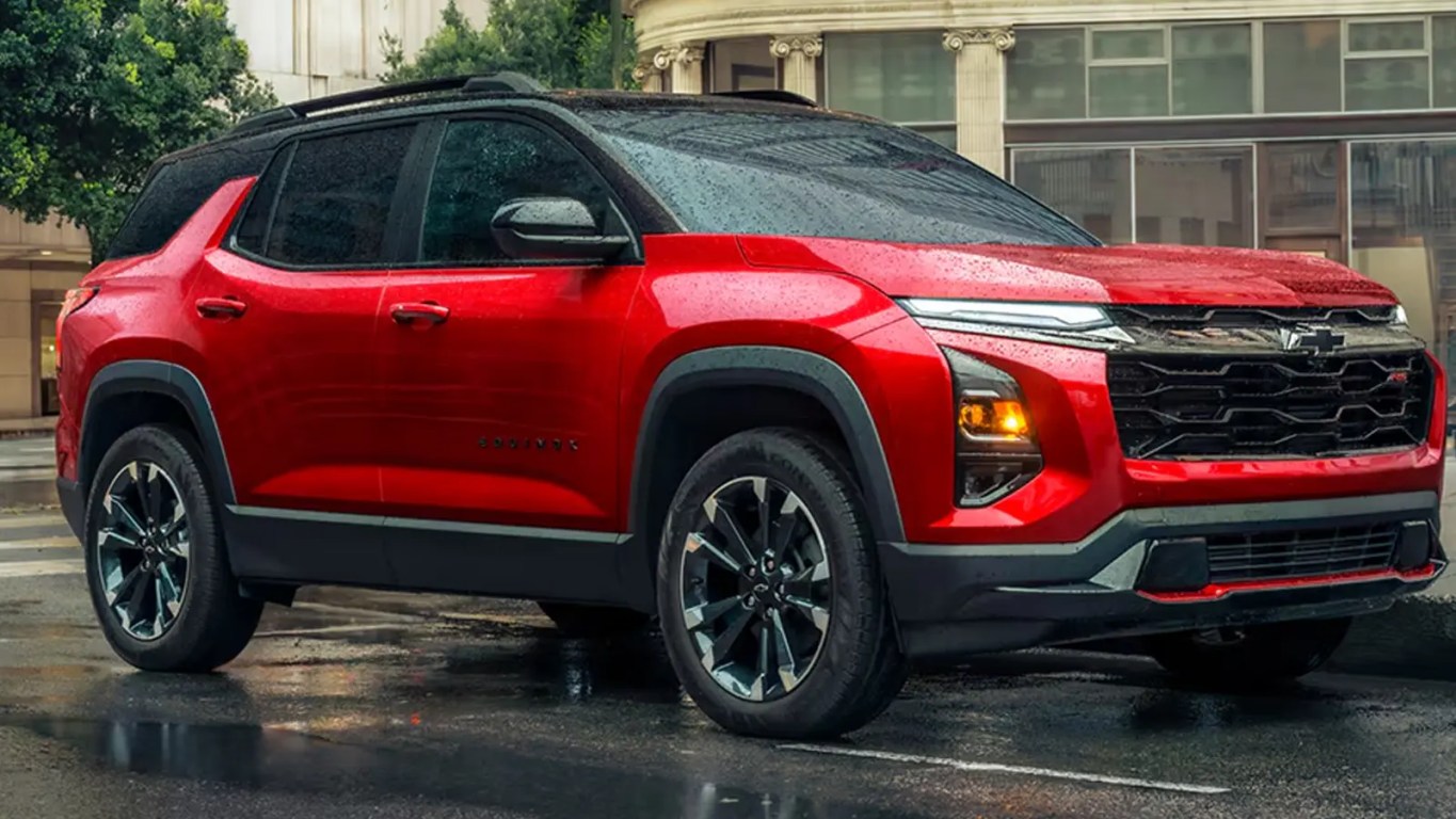 A 2026 Chevy Equinox Activ in red against a city background.