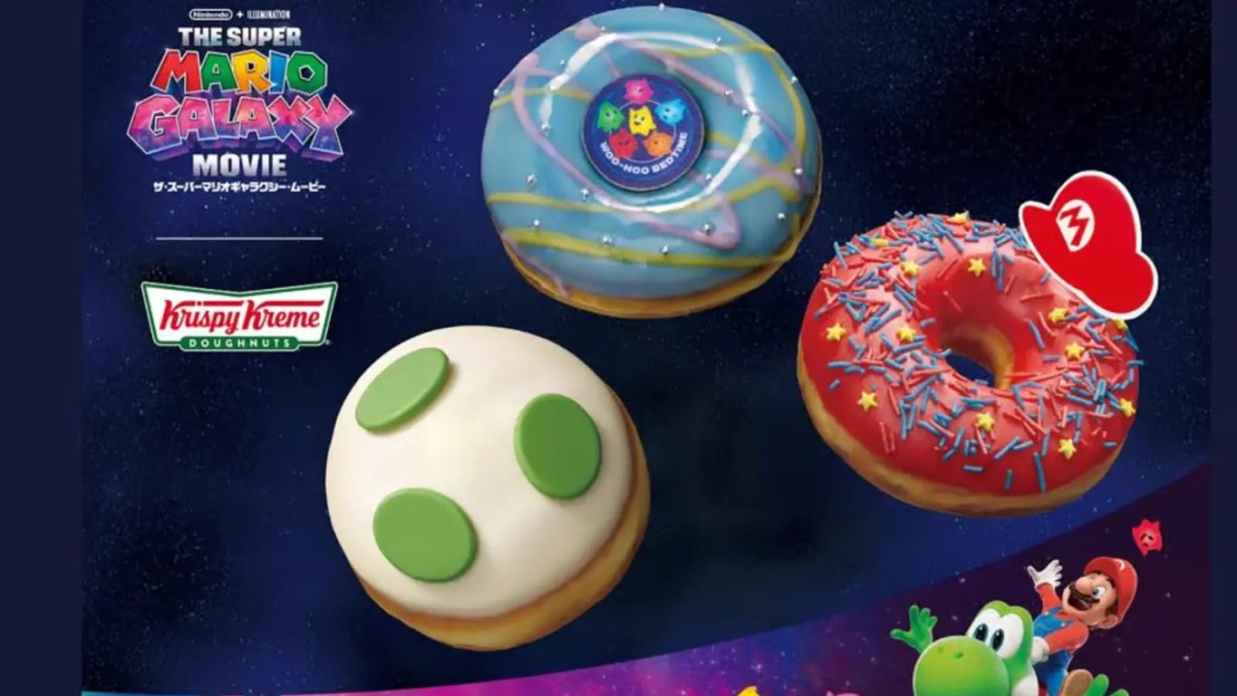 A box of limited-edition Krispy Kreme donuts themed after the Super Mario Galaxy Movie, featuring Star Bit sprinkles and Rosalina branding.