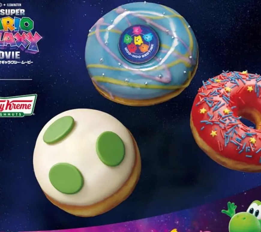 A box of limited-edition Krispy Kreme donuts themed after the Super Mario Galaxy Movie, featuring Star Bit sprinkles and Rosalina branding.