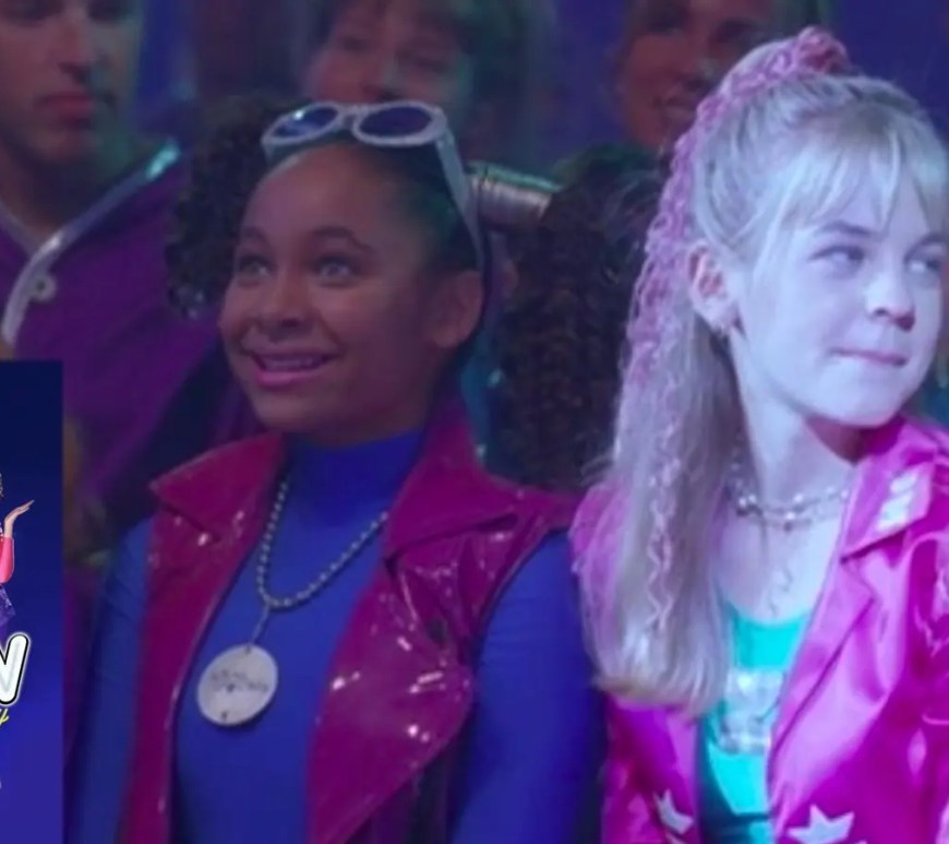 ilm still from Disney’s Zenon: Girl of the 21st Century (1999) featuring Zenon Kar (Kirsten Storms) and Nebula Wade (Raven-Symoné). Zenon wears a metallic pink vest over a blue spandex turtleneck with her signature pigtails, while Nebula sports neon purple athletic wear. They are standing in the futuristic, brightly lit corridor of Space Station 9, embodying the Y2K-futurism aesthetic.