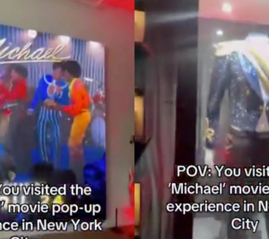 A detailed view of the iconic 1984 Grammy Awards ensemble on display at 620 Broadway. The hardware includes the navy blue military-style jacket with gold sequin piping and a regal sash, paired with the singular crystal-encrusted white glove and dark aviator sunglasses.