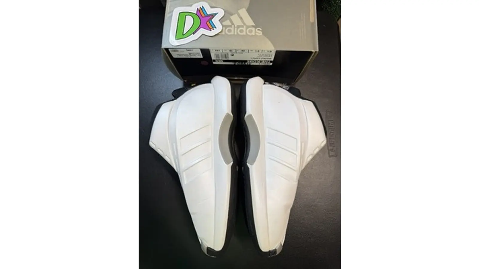 The 2000 Adidas 'The Kobe' in the signature white colorway, showing the Audi TT-inspired molded upper.