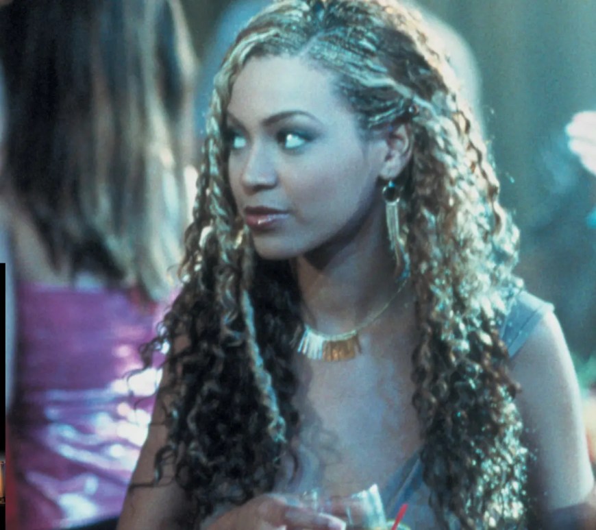 A movie still of Beyoncé from the 2001 movie "Carmen: A Hip Hopera," alongside the DVD cover.
