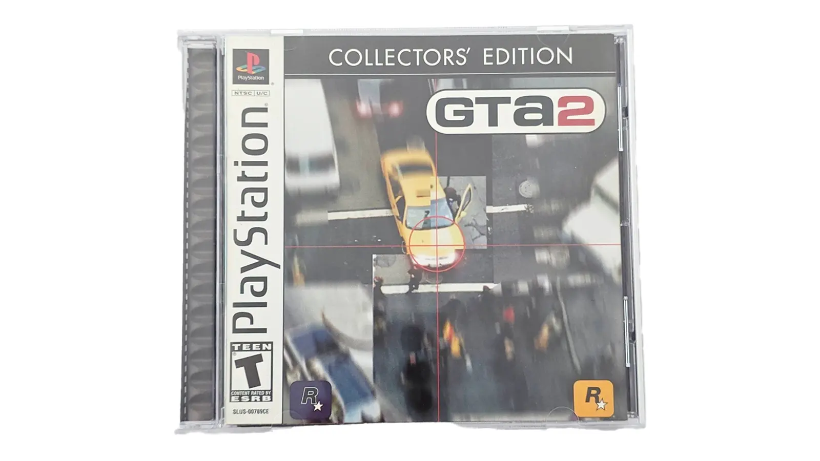 A high-resolution photo of the 2004 Grand Theft Auto: The Classics Collection Big Box. The front cover features a black and gray industrial design with metallic red lettering. The box is shown open, revealing three separate jewel cases for Grand Theft Auto, GTA: London 1969, and GTA2, along with folded physical maps of Anywhere City and Liberty City.