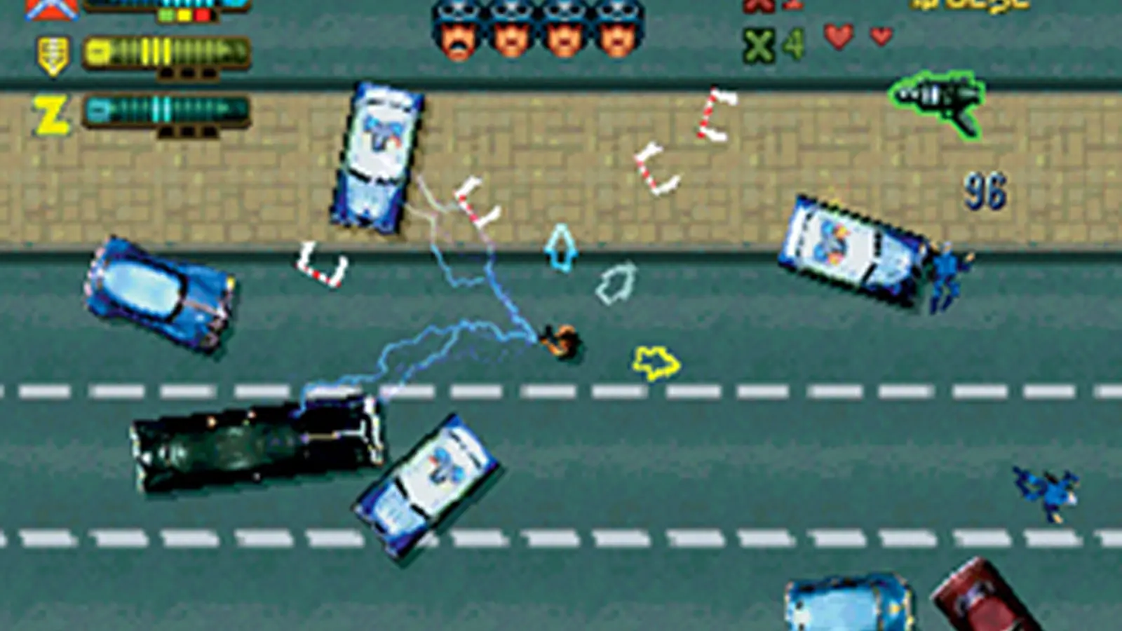 A top-down screenshot of GTA II featuring a Z-type car speeding through the city.