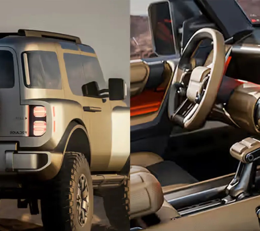 The interior and exterior of the Hyundai Boulder Concept focusing on the driver's cockpit. The dashboard features four discrete square digital displays, chunky physical knobs and buttons for tactile off-road control, and heavy-duty grab bars. A fold-out tray table is visible on the passenger side, emphasizing the "mobile basecamp" utility of the cabin.