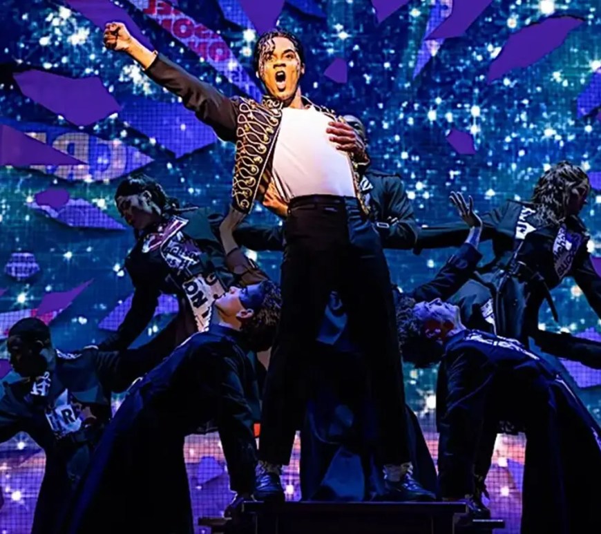 The illuminated marquee of the QPAC Lyric Theatre in Brisbane during the April 2026 premiere of "MJ the Musical," featuring the iconic silhouette logo of Michael Jackson against a vibrant red background.