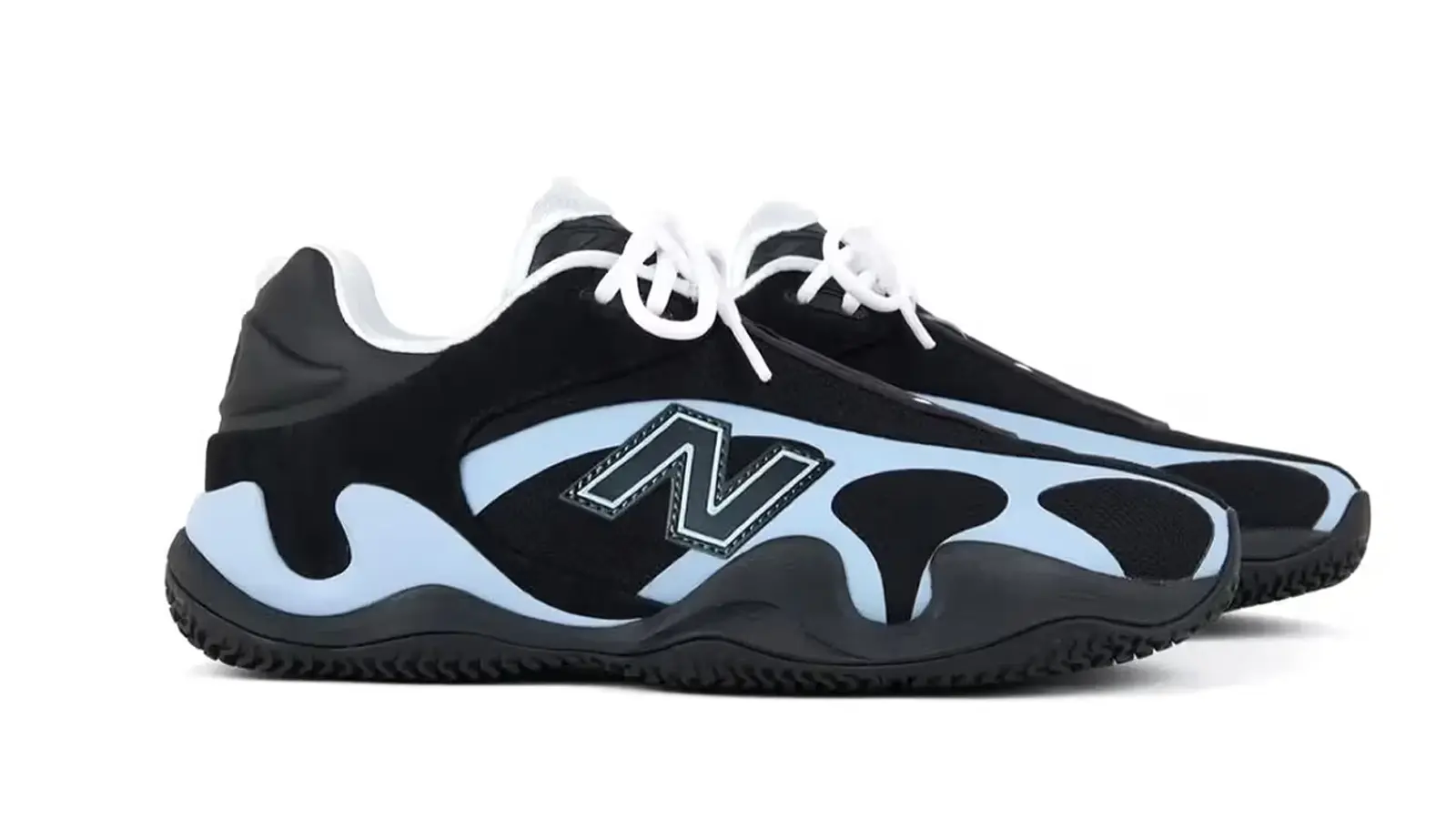 Side view of the New Balance Maxey v1 signature basketball shoe in a black and blue colorway, highlighting the sculpted FuelCell midsole and low-top silhouette.