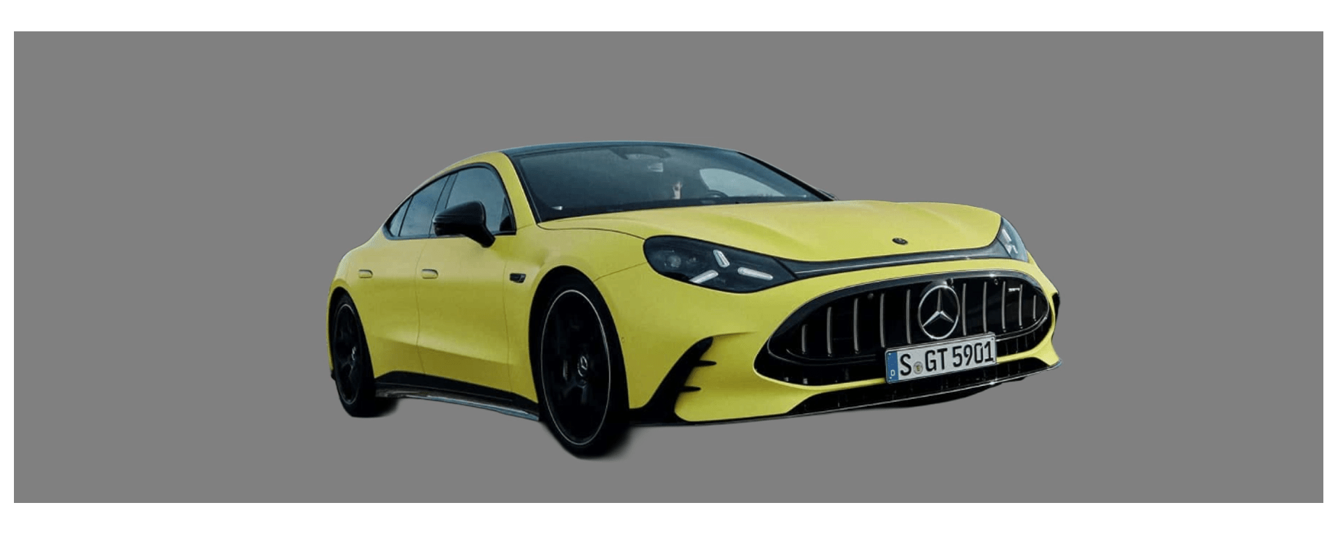 Exterior front three-quarter view of the 2027 Mercedes-AMG GT 4-Door EV featuring star-shaped LED headlights and a low-slung, fastback profile.