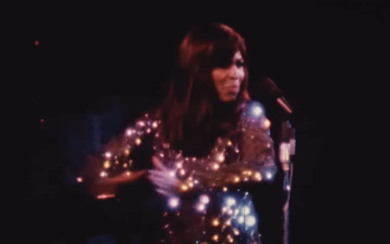 A still of Tina Turner performing in the early 1970s.