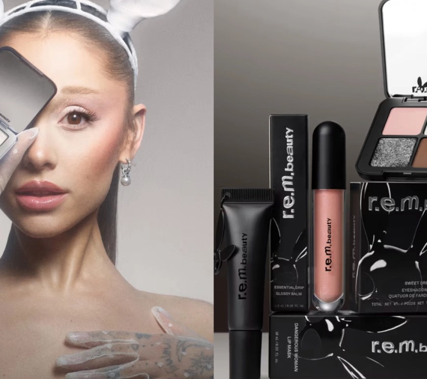 A promotional close-up of Ariana Grande for the r.e.m. beauty "Dangerous Woman" 10th Anniversary Collection. She is seen in a moody, cinematic noir-inspired shot, nodding to her 2016 album era. Ariana is wearing her signature high ponytail and a sleek black outfit, holding the limited-edition "Sweet Dreams" eyeshadow quad. Her makeup features a soft, smoky "midnight" eye look and a high-shine neutral lip from the collection, set against a dark, atmospheric background that captures the "Super Bunny" aesthetic.