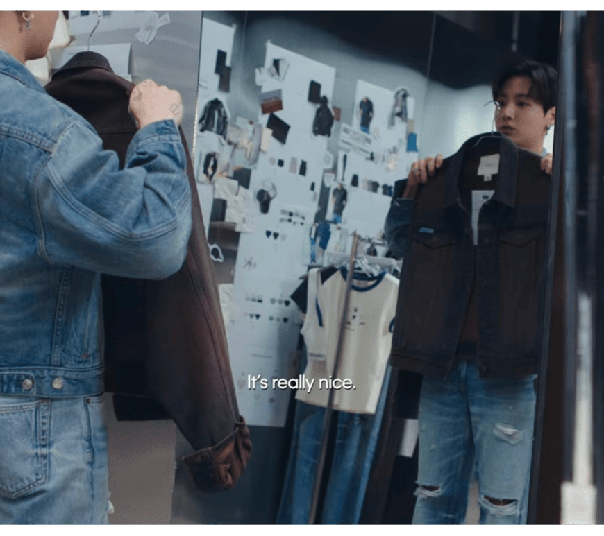 A still of Jung Kook describing his Calvin Klein collection while showcasing the denim jeans and jacket