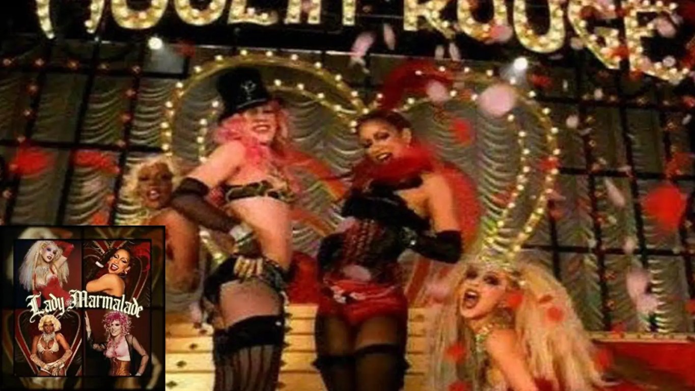 A wide interior shot of the vibrant, cabaret-style Moulin Rouge stage set from the 2001 Lady Marmalade music video execution.
