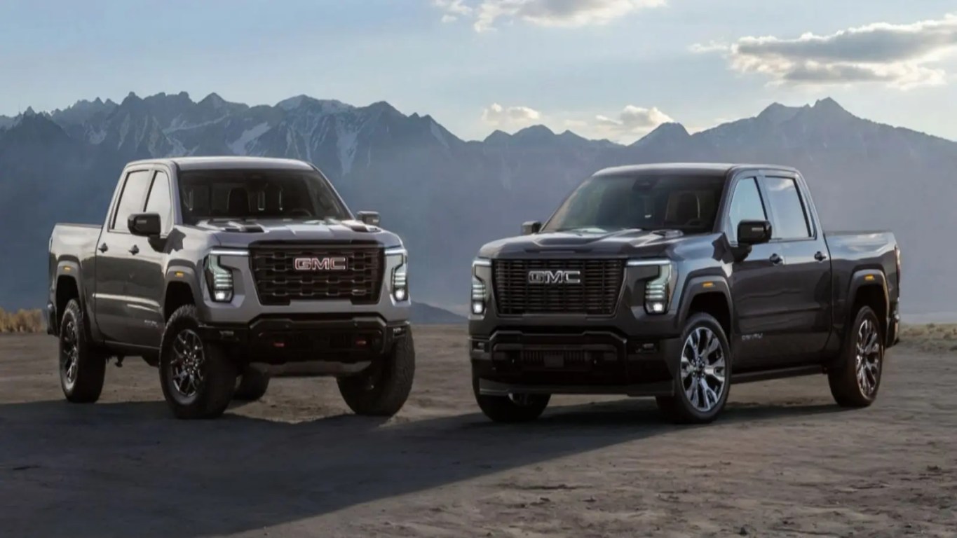 A clean, high-resolution automotive profile shot displaying the redesigned front grille and bright LED headlights of the premium 2027 GMC Sierra 1500 Denali truck.