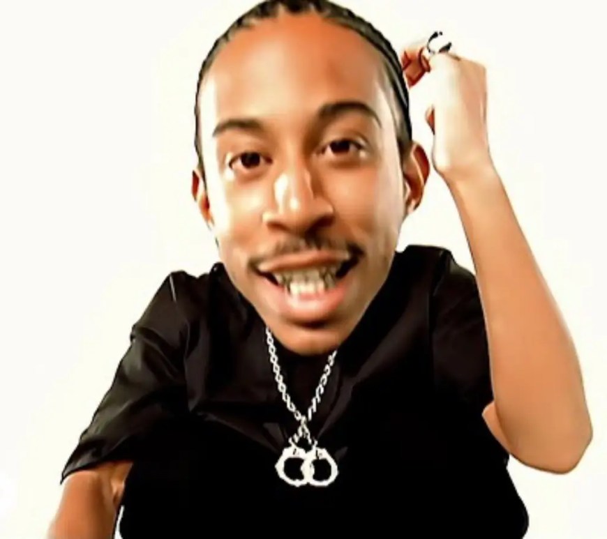 A clean vintage studio archive photo showcasing the original physical CD single artwork for Ludacris' Rollout (My Business) resting on a dark surface.