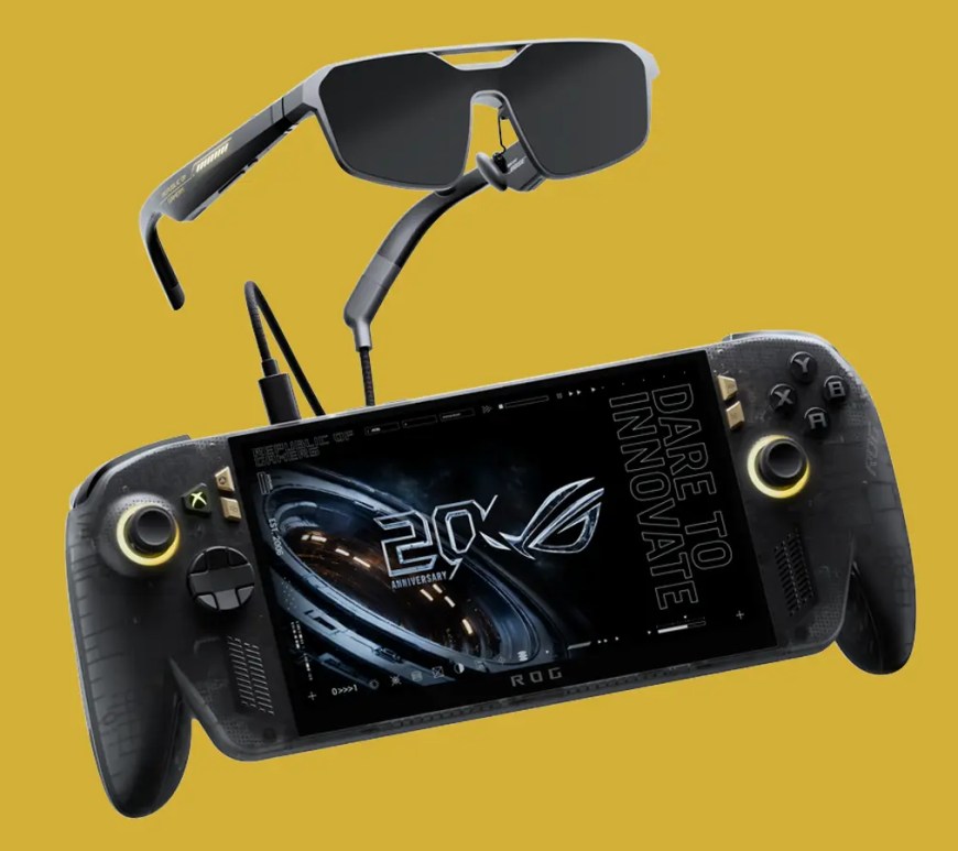 The translucent black and gold ASUS ROG Xbox Ally X20 handheld console sitting next to matching gold-accented AR gaming glasses.
