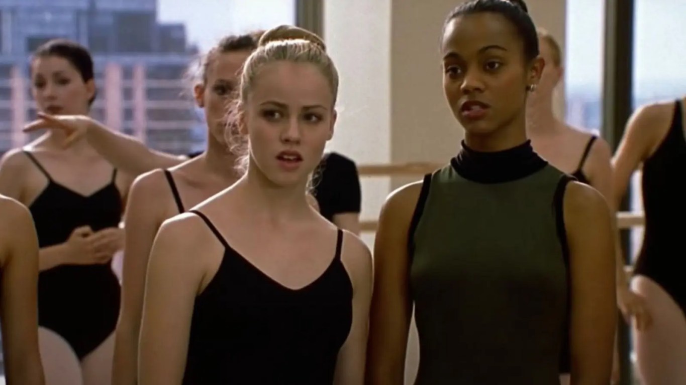 A vibrant production still from 2000 showcasing Zoe Saldana