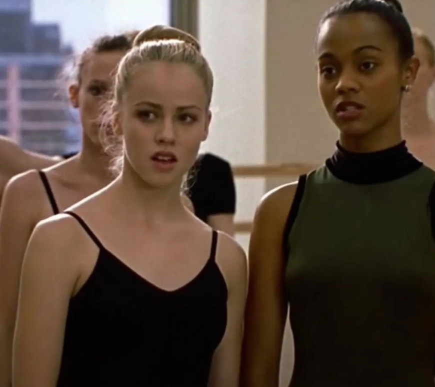 A vibrant production still from 2000 showcasing Zoe Saldana